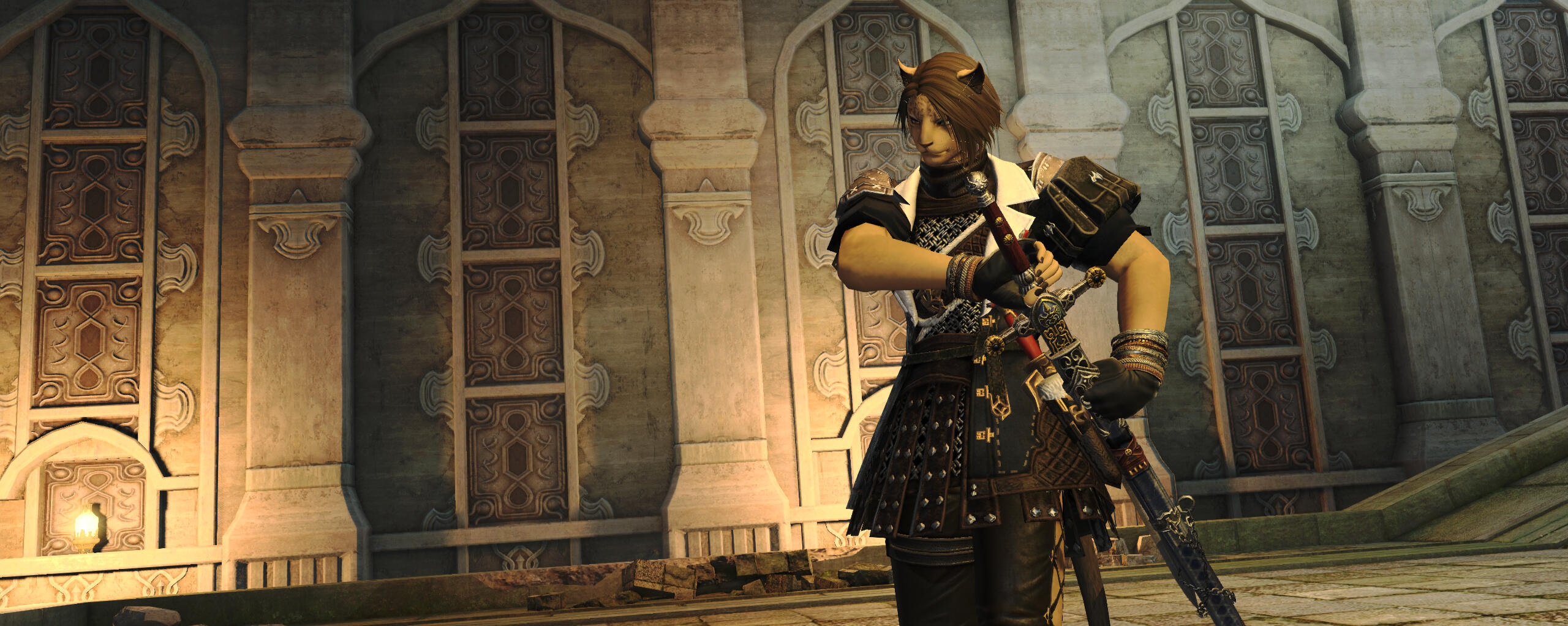 In stone ruins, Kreja begins to draw her sword from its sheath. She is dressed in sleeveless chain armor.